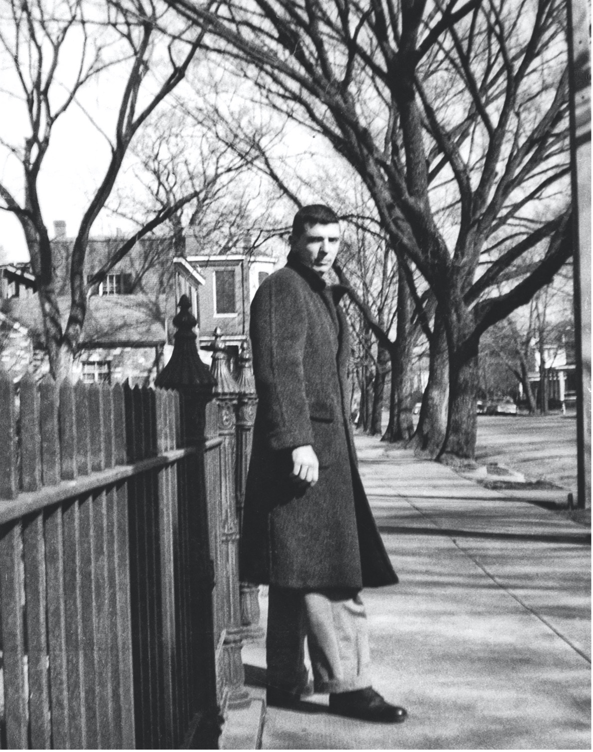 Photo courtesy of The Artist Book Foundation (Robert Kipniss in overcoat on sidewalk, Petersberg, VA, 1957)